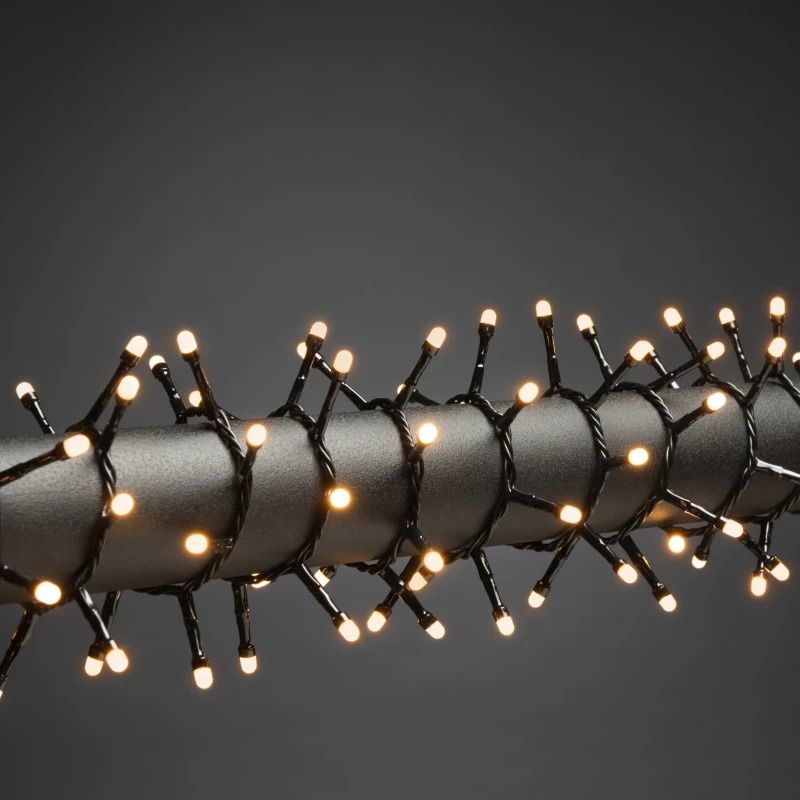 Konstsmide Micro LED Compact Lichtsnoer | 200 Lichtpunten 3.6W Extra Warmwit Frost | 4.38m Spacing 2.2cm 30V Binnentrafo Zwarte Kabel Binnen